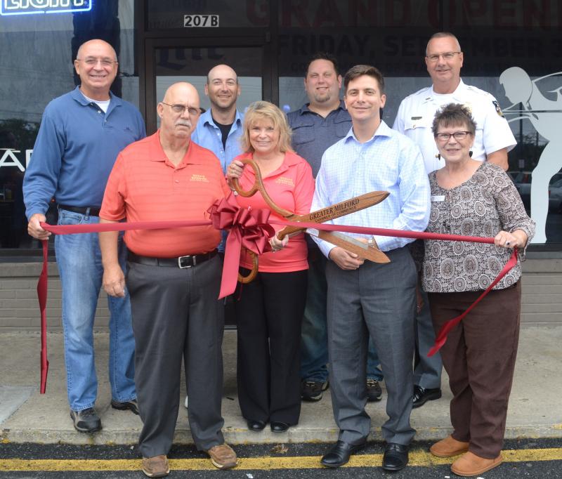 Shown are in back (l-r) City of Milford Vice Mayor Doug Morrow; Jacob "Preach" Dant, Milford Billiards manager; Thomas Dronebarger, Milford Billiards bartender; and City of Milford Police Chief Kenneth Brown. In front are Leo Weigand and Sherrie Weigand, Milford Billiards owners and operators; City of Milford Mayor Bryan Shupe; and CCG Executive Secretary Alicia Hollis. SUBMITTED PHOTO